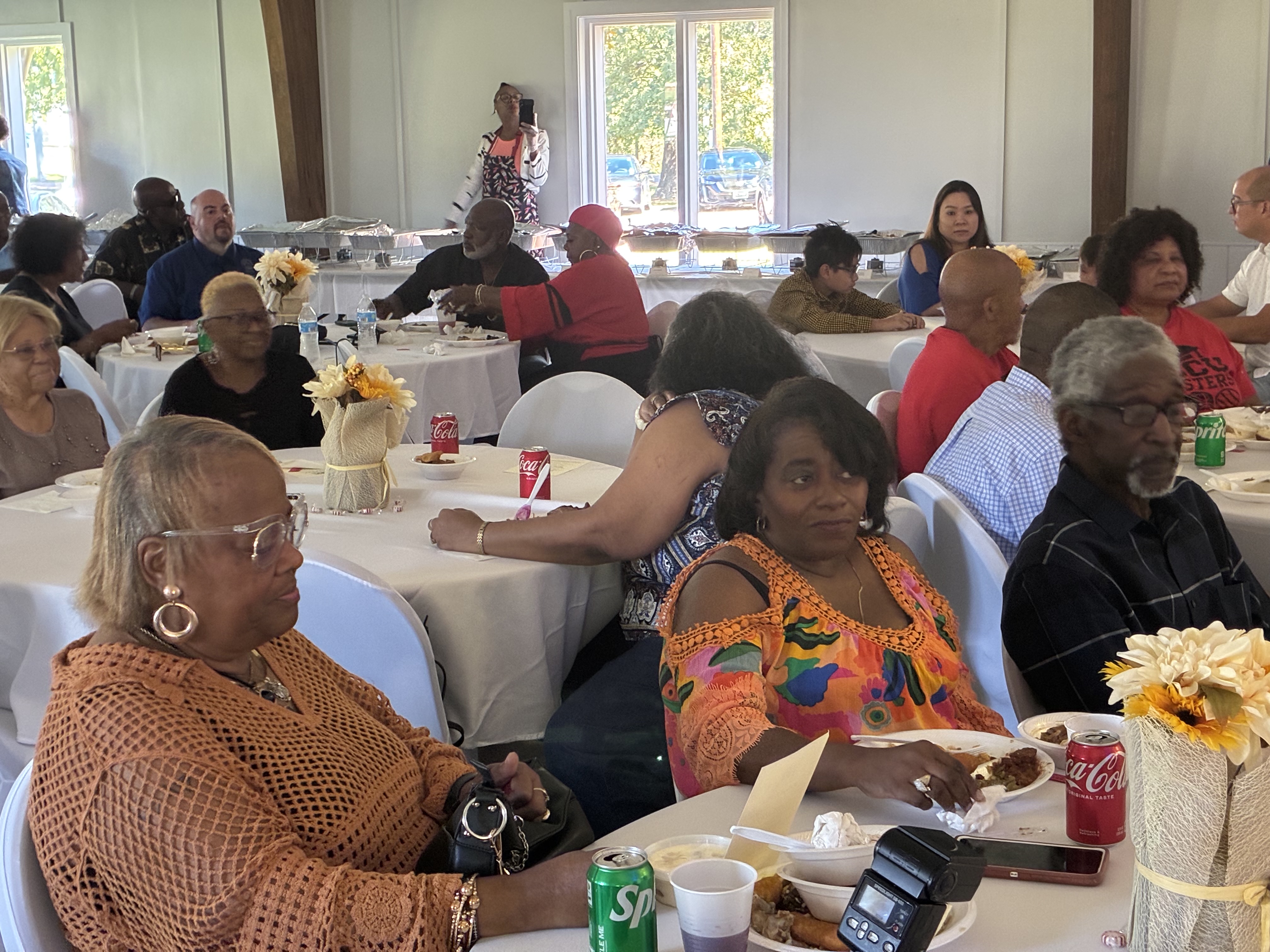 Community members seated together at Food Fest 2025