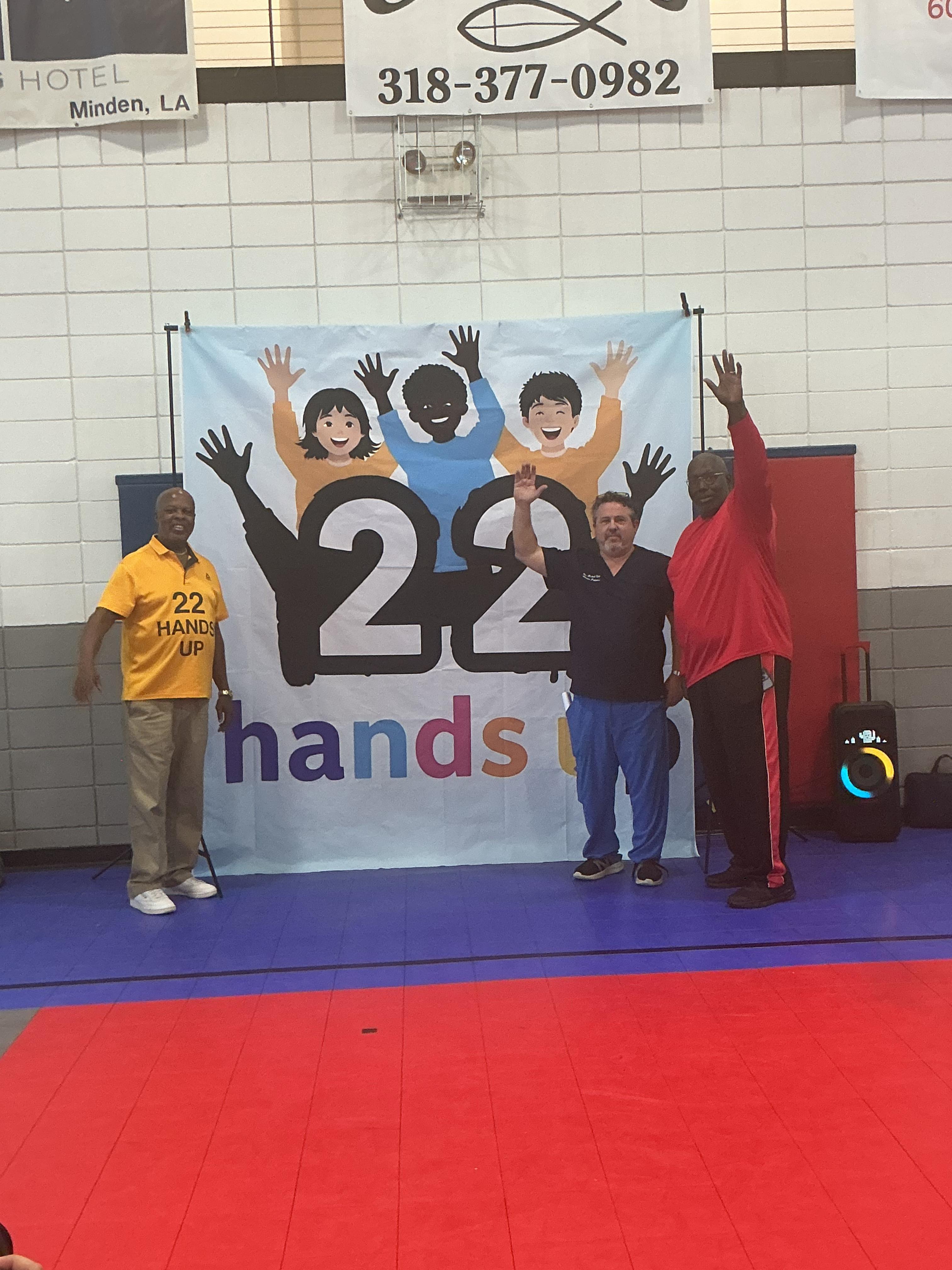 Team members with hands up
